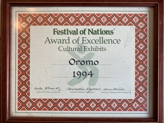 Award presented to the designers of a Oromo cultural exhibit at the Festival of Nations